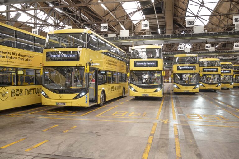 BYD ADL Enviro400EVs sat at Oldham depot under the new charging gantries displaying "Transport for Manchester". Courtesy: Transport for GREATER Manchester